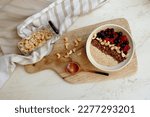 healthy breakfast. oatmeal with berries, granola and nuts