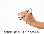 Small photo of female left hand exercising with a hand griper isolated in white background