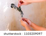 Woman Hand Open Water Tap And...