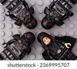 Small photo of Tambov, Russian Federation - October 01, 2023 Four Lego Star Wars character minifigures - Luke Skywalker and 3 Dark Troopers, on a gray baseplate background.