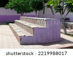 Colorful bleachers in a park. Bleachers for kids to sit in a public park so as to watch sportive activities.