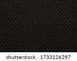 Small photo of Seamless black 'loopback' style carpet background texture.