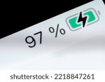 Small photo of Smartphone charged pixel battery level indicator - charging process - ninety-seven, 97 percent: close up macro view of gadget display, screen. Energy, technology, power, digital and symbol concept