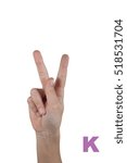 Small photo of letter K made by fingers isolated on white background. Dactylic, nonverbal alphabet