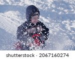 boy sledding down on snow hill... | Shutterstock . vector #2067160274