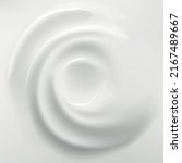 White cream background. Swirl blended mousse. Cosmetic or dairy product. Liquid spirals top view. Creamy whirlpool. Whipped vanilla dessert. Smooth vortex with twirls
