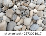 Small photo of A collection of naturally scattered gravel stones, creating intriguing textures and patterns on the ground.
