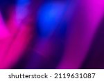 Defocused neon glow. Light flare overlay. Futuristic led illumination. Blur ultraviolet magenta pink purple blue color radiance on dark abstract background.