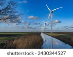 Small photo of Windmills in the Polder to generate electricity. In many places the horizon is full of wind turbines to keep pace with energy progress. There is always wind (energy) in Dutch polders.