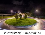 Roundabout in Bergen Norway at night. Light trail from cars.