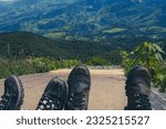 Small photo of view of the valley from the top of the mountains with two pairs of trail boots in Itamonte, Serra Fina, Minas Gerais, Brazil
