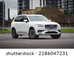 Small photo of St Petersburg, Russia - August 02, 2022: Volvo XC90 II Restyling B5 front view, three quarters view, headlight on
