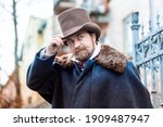 Elegant man of the nineteenth century. Vintage. in classic retro clothes, coat and hat.
