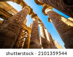 Small photo of EGYPT - KARNAK TEMPLE - Travel tour group wanders through Karnak Temple. Beautiful Egyptian landmark with hieroglyphics, decayed temples, obelisks, towers, and other buildings. Luxor, Egypt