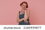 Small photo of Happy young woman laughing out loud after hearing ridiculous anecdote, funny joke, feeling carefree amused, positive people lifestyle. Ginger freckles girl isolated alone on pink studio background