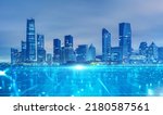 Small photo of Panoramic urban architecture, cityscape with space and neon light effects. Modern hi-tech, science, futuristic technology concept. Abstract digital high-tech city design for banner background