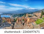 Small photo of Ruins of ancient Greek theater in Taormina and Etna volcano in the background. Coast of Giardini-Naxos bay, Sicily, Italy, Europe.