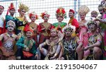 Small photo of Jakarta, Indonesia - August 19, 2022: A group of Indonesian traditional dancers wearing traditional clothes from various tribes in Indonesia taking pictures together before appearing at an event