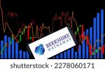 Small photo of Jakarta - March 21,2023: Berkshire Hathaway Inc. logo with stock market chart background. is an American multinational conglomerate holding company founded by Oliver Chace and Warren Buffett