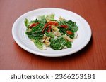 Small photo of Stir fry Chinese cabbage, stir fry Napa cabbage, tumis sawi putih served on white plate on isolated background. Stir fried Chinese cabbage, stir fried Napa cabbage