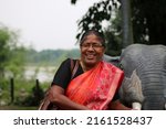 Small photo of Tetulia, Bangladesh- May 02, 2022: A middle age woman is smiling with Sprightly That is very professional photo captured. High quality, Alive etc.