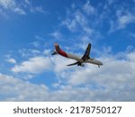 Small photo of BARCELONA, SPAIN - 1st of July 2022: Iberia airplane landing in Barcelona- El Prat Airport. Iberia is a spanish airline. Views from "El Delta del Llobregat"