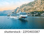 Small photo of KOTOR, MONTENEGRO - SEPTEMBER 5, 2022: Cruise ship Norwegian Gem of NCL Norwegian Cruise line sailing away from Kotor, Montenegro.