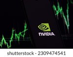 Small photo of Nvidia investment growth and profit trading concept. Nvidia company logo on screen of smartphone against blurred background of up trading stock chart. USA, May 26, 2023