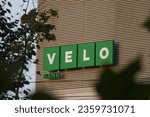 Small photo of Signboard with name and logo of the bank "Velo" on a facade of a modern office building, Warsaw, Poland - September 8th 2023