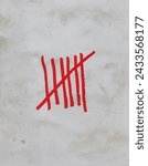 Small photo of Dirty distressed white stucco wall with red tally marks. Six vertical lines and one line crossing them off equalling seven.