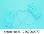 Close up blue mittens and heart ...