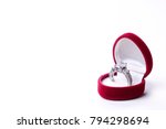 Beautiful shiny platinum engagement ring with big gem diamond in rich red velvet box isolated on white background. st Valentine's Day proposal gesture present. Copy space, front top view, background
