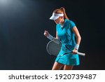 Tennis Player With Racket In...