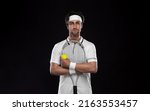 Tennis player with racket in...