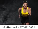 Small photo of Download picture for the music collection for running. Sprinter run. Woman running on black background. Fitness and sport motivation. Runner concept.