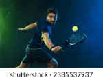 Padel tennis player with racket ...