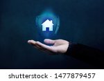 House or Family Insurance Concept. Company Supporting and Protecting their Customer by Shield, Home Icon floating over a Careful Gesture Hand of a Businessman