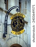 Small photo of Geneva, Switzerland, Europe - 04.2013 : Christie's sign hanging above entrance to saleroom of famous Christie's auction house in the Old Town of the city, Place de la Taconnerie