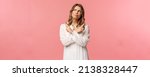 Small photo of Beauty, fashion and women concept. Girl having problem with picking, making serious decision. Attractive blond woman look up thoughtful, smirk and grimacing, pointing sideways, point left and right.