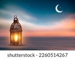Small photo of Ornamental Arabic lantern with burning candle glowing . Festive greeting card, invitation for Muslim holy month Ramadan Kareem. Ramadan Kareem greeting photo with serene mosque background.