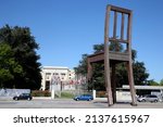 Small photo of The Broken Chair by Daniel Berset, Memorial to the victims of landmines in front of the United Nations Building. Geneva. Switzerland. 05-25-2015