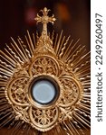 Small photo of The Blessed Sacrament in a monstrance. Eucharist adoration. France.