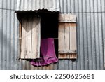Small photo of Poor housing. Temporary home that downgrade from metal sheet. Vietnam.