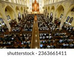 Small photo of Song Vinh catholic church. Catholic devotees during Holy Thursday Mass. Holy Thursday is the commemoration of the Last Supper of Jesus Christ. Vietnam. 04-30-2023