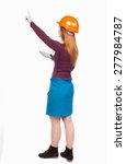 Small photo of Backview of business woman in construction helmet with tablet pc pointing. Standing young girl. Rear view people collection. backside view of person. Engineer scorekeeper hand shows the work front.