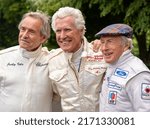 Small photo of Goodwood, Sussex, UK - 24 Jun 2022: Jackie Stewart, Jacky Ickx, Jean-Francois Decaux, former Grand Prix and Le Mans champions, enjoy racing at the Festival of Speed; celebrating 75 years of Ferrari