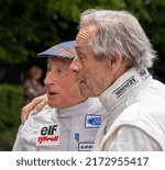 Small photo of Goodwood, Sussex, UK - 23 Jun 2022: Sir Jackie Stewart and his old friend and rival Jacky Ickx (in softer focus) look into the distance (left) while waiting to race at the Festival of Speed.