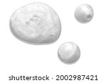 Small photo of Pearly white thick creamy texture with bubbles. Soap or liquid cream with pearl colour on white background. Milky blobs.