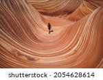 Girl Hikes Through The Wave...