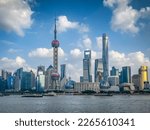 Small photo of A view of Pudong from The Bund with the Pearl and modern architecture skyline.